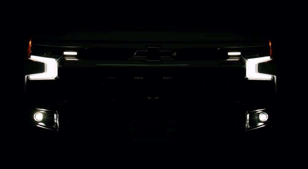 A 2023 Chevy Silverado 1500 ZR2 Bison is shown from the front parked in the dark.
