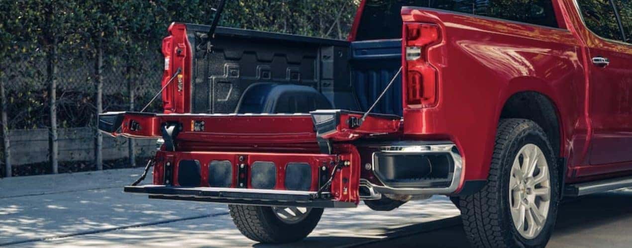 A red 2022 Chevy Silverado 1500 RST is shown from the rear.