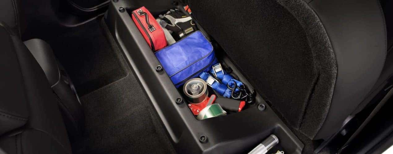 The black interior of a 2022 Chevy Colorado Z71 shows extra storage.
