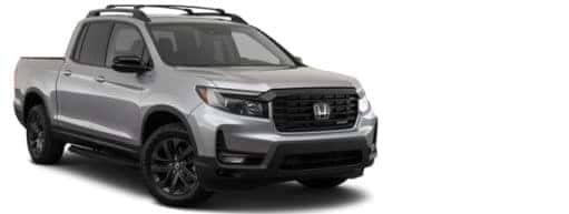 A silver 2023 Honda Ridgeline is shown angled right.