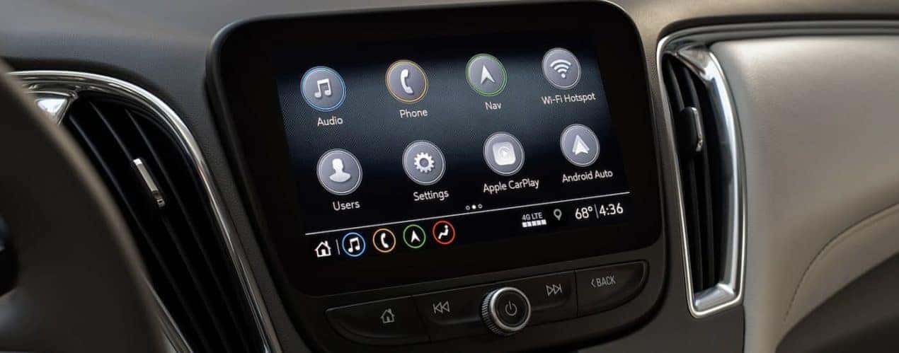 The grey interior of a 2022 Chevy Malibu shows the infotainment screen.