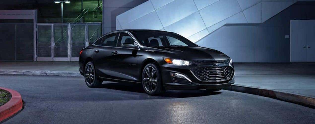 A black 2022 Chevy Malibu is shown during a 2022 Chevy Malibu vs 2022 Subaru Legacy comparison.