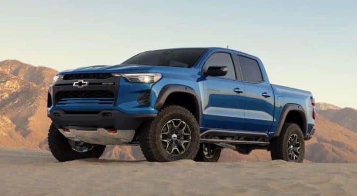 A blue 2023 Chevy Colorado ZR2 is shown from the side after leaving an Atlanta lifted truck dealer.