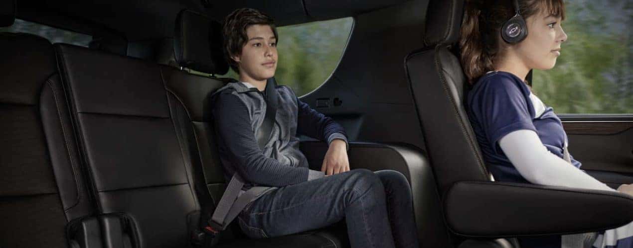 The black interior of 2023 Chevy Tahoe shows two rows of seating.