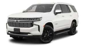 A white 2023 Chevy Tahoe is angled left.