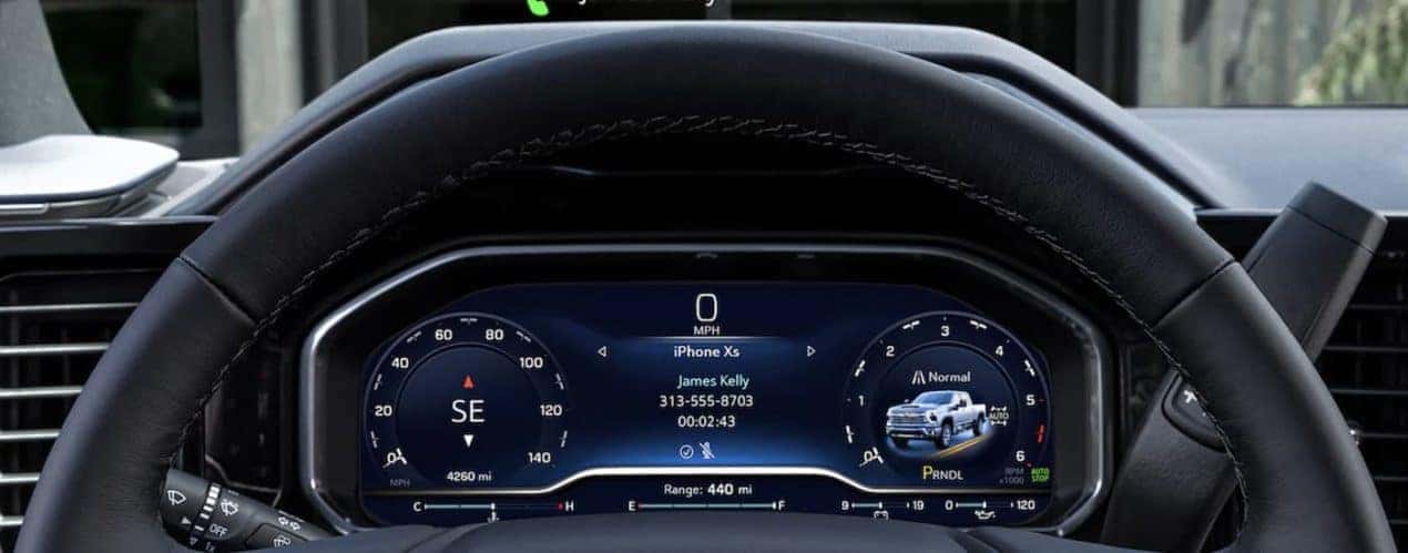 The black interior of a 2024 Chevy Silverado 2500 HD shows the dashboard.