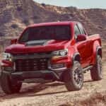 A red 2021 Chevy Colorado ZR2 is shown from the front at an angle after leaving a dealer that has used trucks for sale near Big Creek.