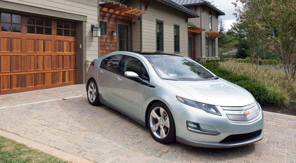 A silver 2011 Chevy Volt is shown parked on a driveway.