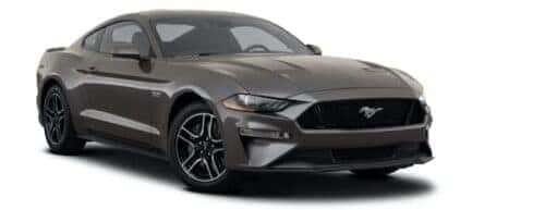A dark grey 2023 Ford Mustang GT is angled right.