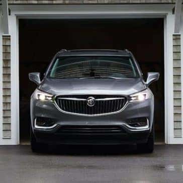 Front view of a silver 2019 Buick Enclave pulling out of a garage