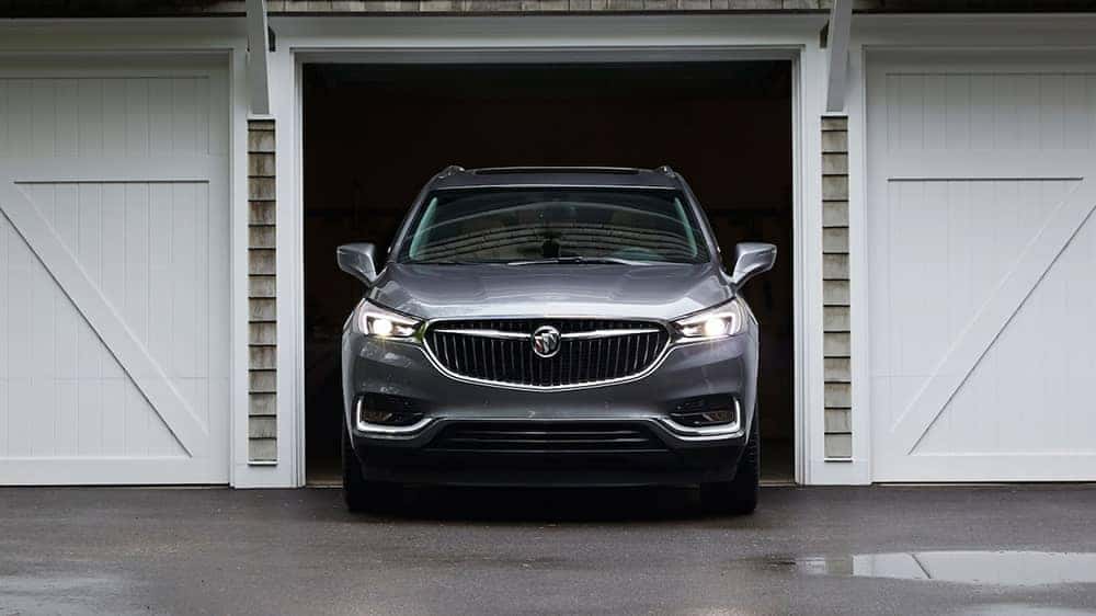 Front view of a silver 2019 Buick Enclave pulling out of a garage