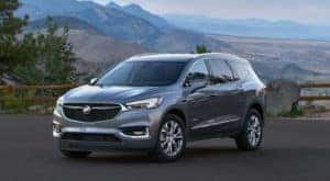 A grey 2022 Buick Enclave is shown from the front at an angle while parked after leaving a Buick dealer in Minot.