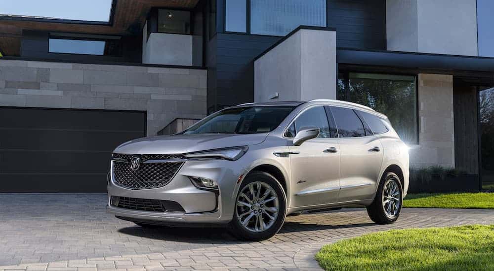 A silver 2023 Buick Enclave is shown from the front at an angle.