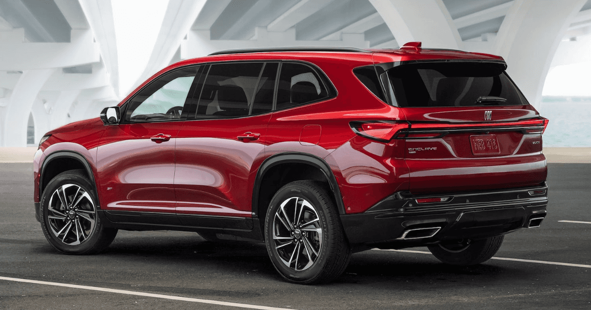 A red 2025 Buick Enclave parked underneath a white bridge