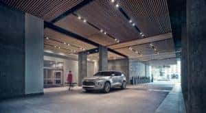A silver 2019 Chevy Blazer Premier is shown parked in front of a building.