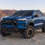 A blue 2023 Chevy Colorado ZR2 is shown from the front at an angle.