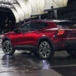 A red 2024 Chevy Trax RS is shown from the rear at an angle.
