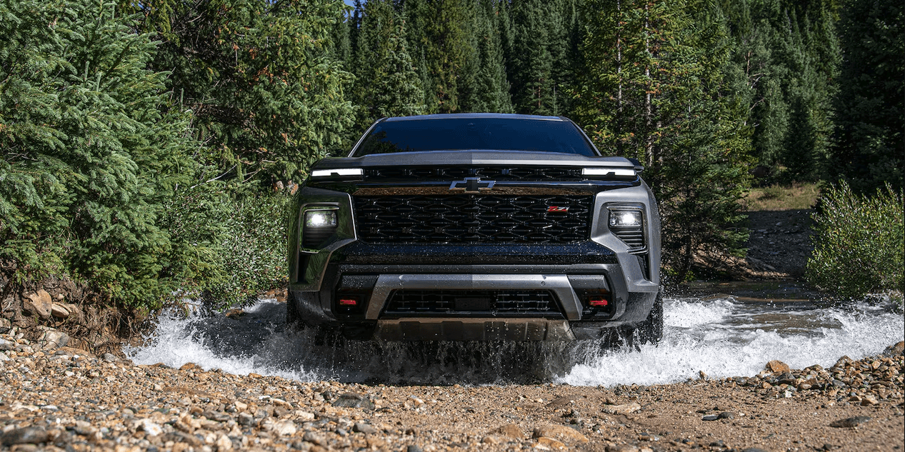 Front view of the 2024 Chevy Traverse driving through water