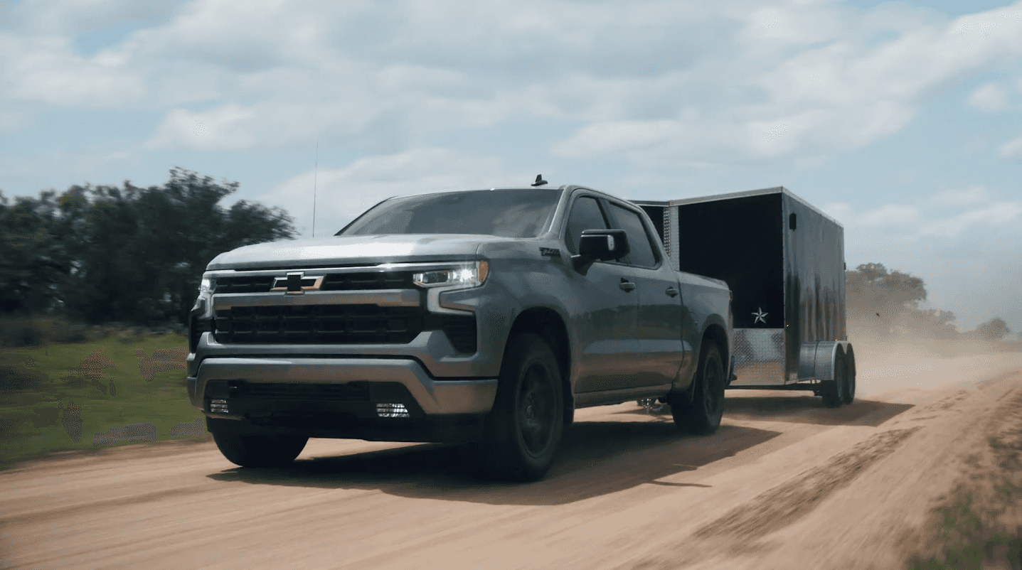 2024 Chevy Silverado 1500 towing on a dirt road