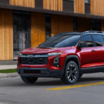 A red Chevrolet Equinox stopped at a stop sign