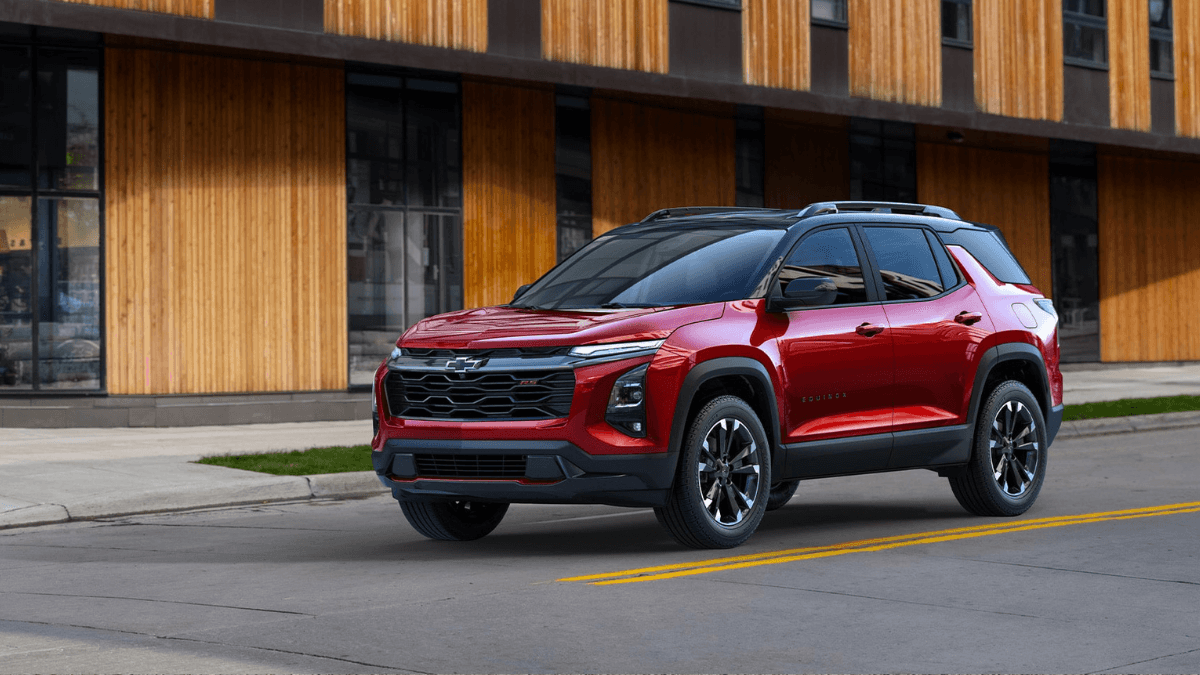 A red Chevrolet Equinox stopped at a stop sign