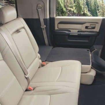 Tan seats folded down in the back of a 2020 Ram 2500