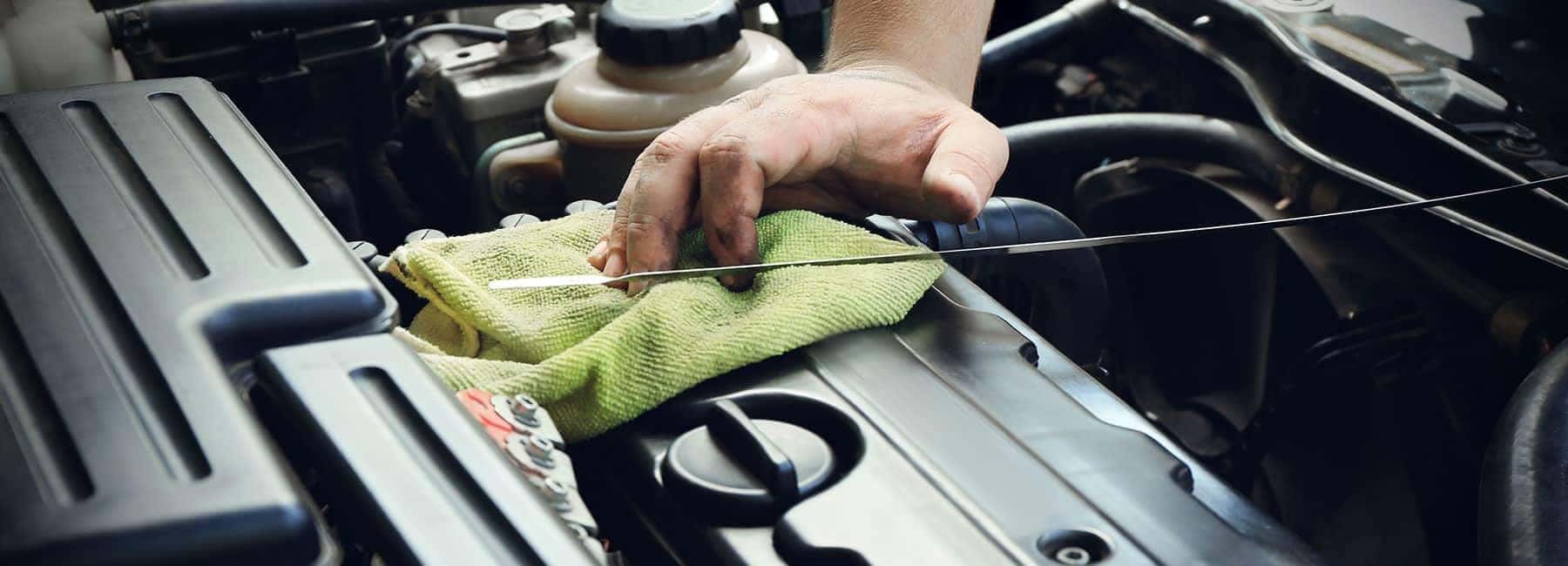 Vehicle technician performing an oil change