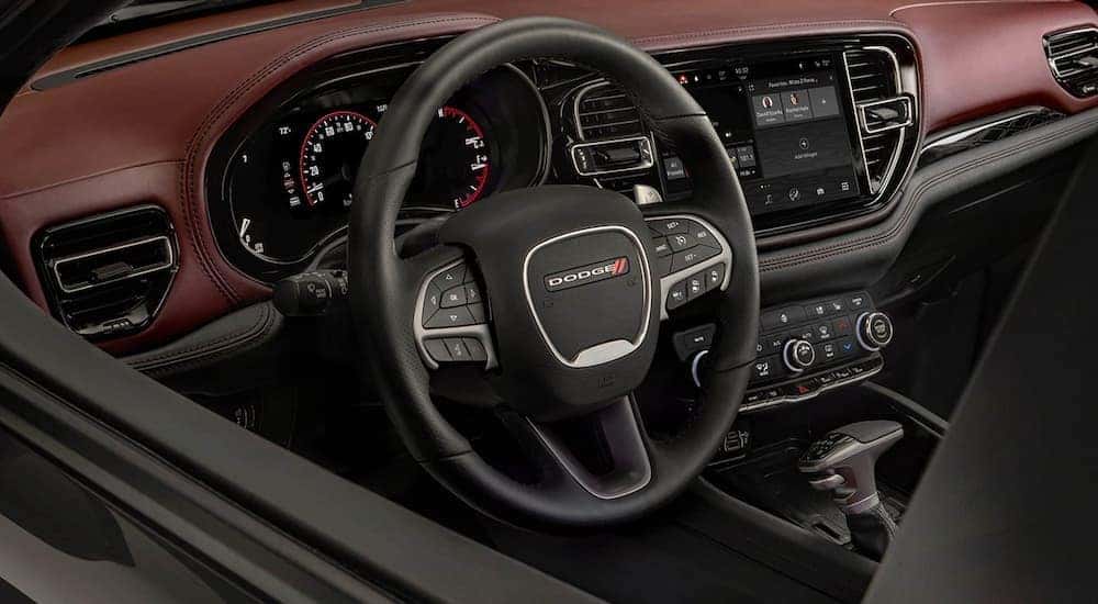Close up of the steering wheel and dashboard in a 2022 Dodge Durango