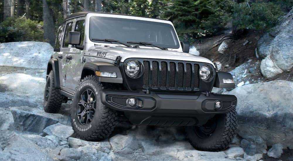 A silver 2020 Jeep Wrangler Willys is shown from the front at an angle.