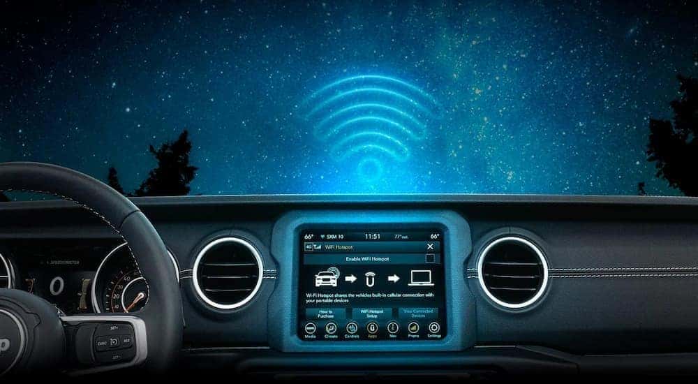 The black interior and dash of a 2023 Jeep Gladiator is shown.