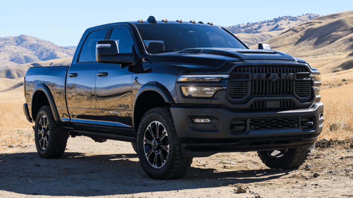 A black RAM 2500 parked in a desert on a dirt road