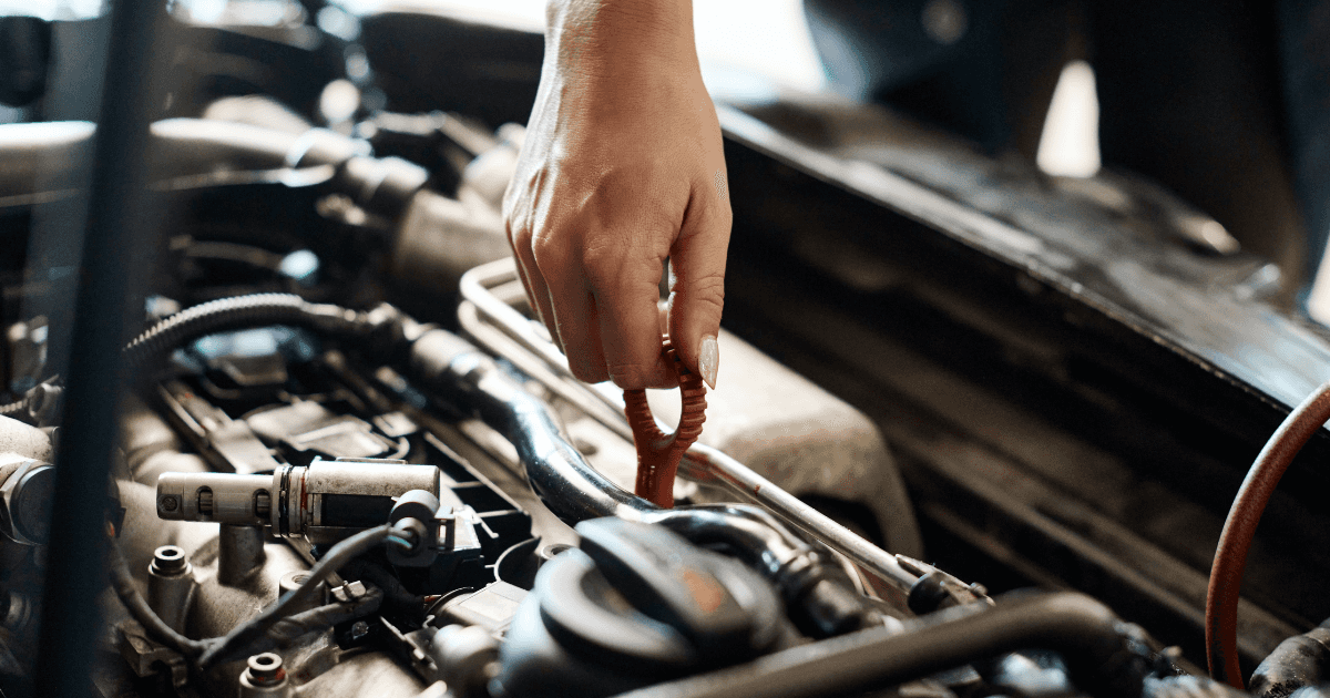 An engineer performing engine service on a vehicle
