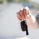 Man Holding Car Keys