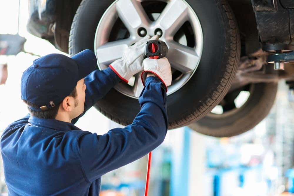 service technician performing tire service