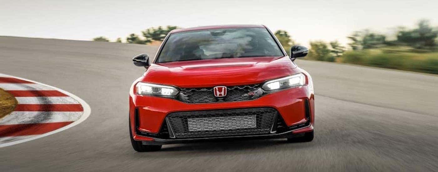 A red 2023 Honda Civic Type R is shown from the front.