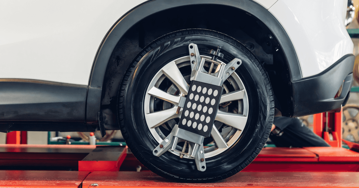 A vehicle's tire receiving a wheel alignment