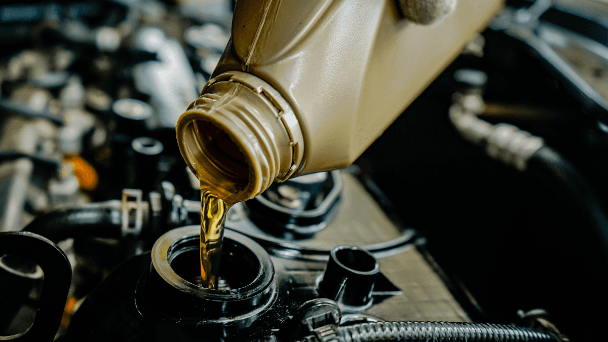 An oil change being performed