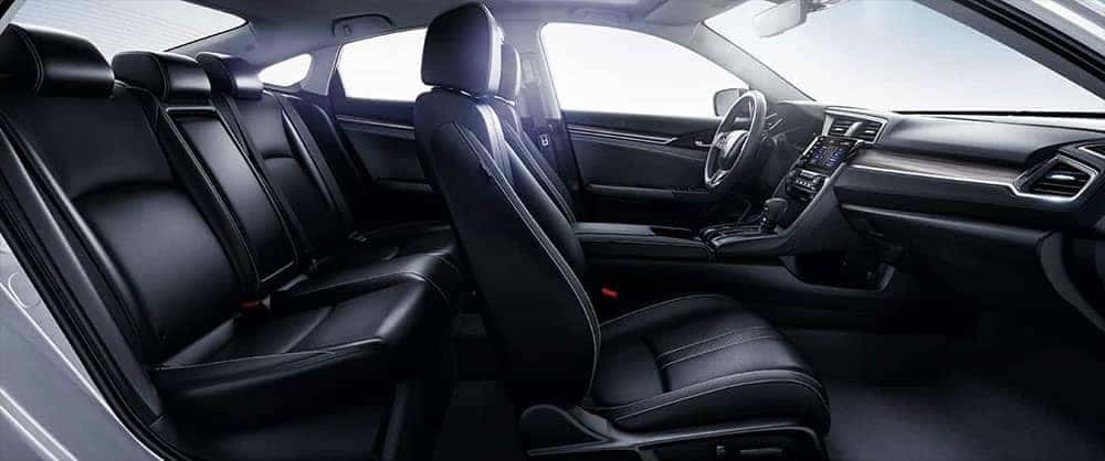 Side view of black leather seats inside a 2019 Honda Civic