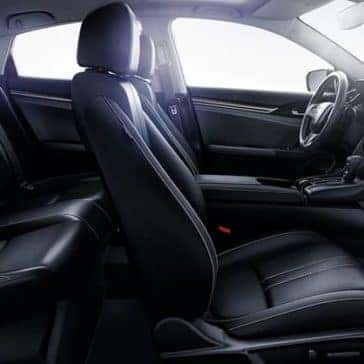Side view of black leather seats inside a 2020 Honda Civic