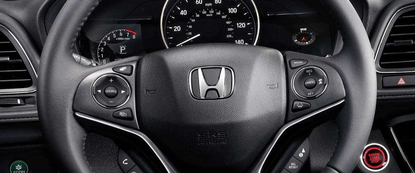 Close up of the Honda logo on a steering wheel