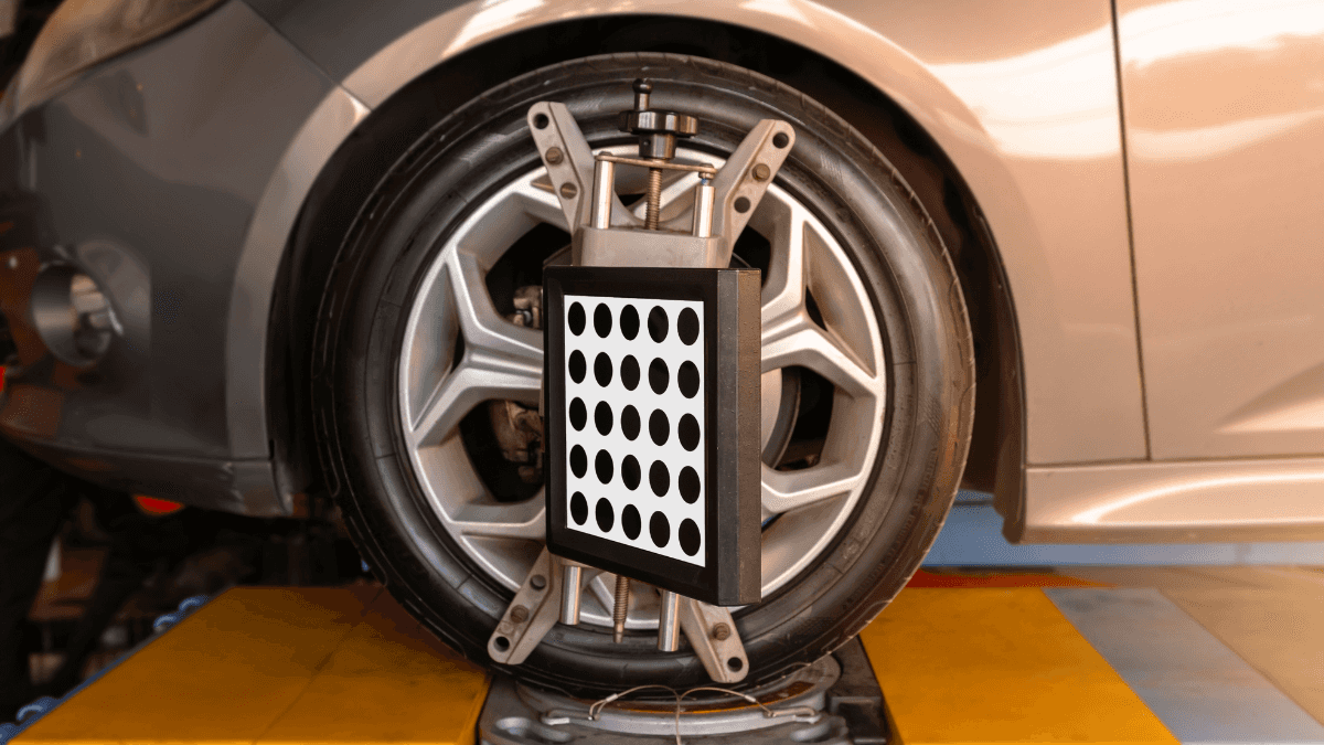 Wheel alignment being performed on vehicle