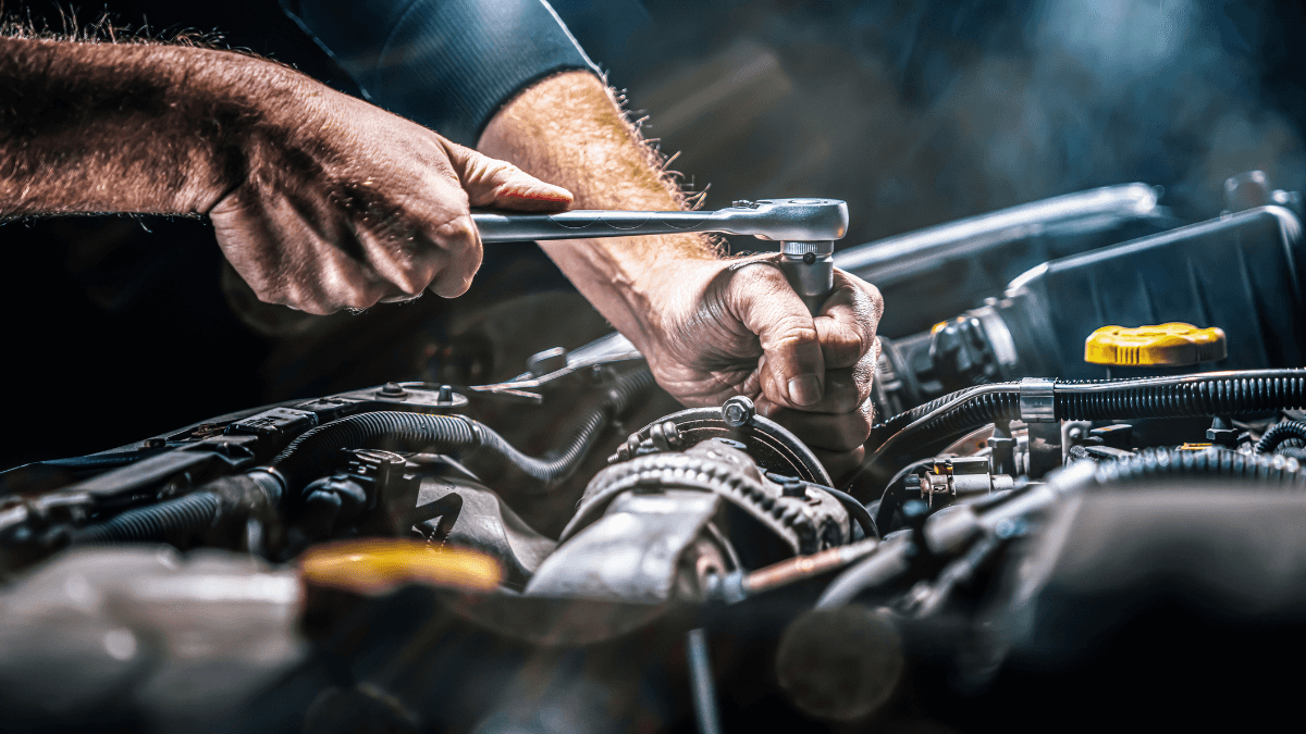 A an engineer working on a vehicle's engine