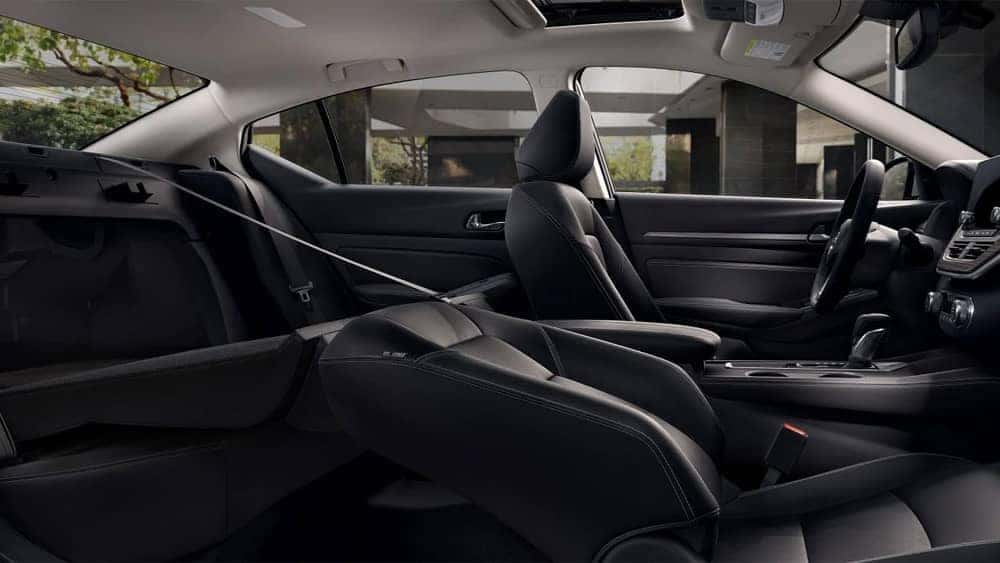 Passenger seats folded down inside a 2020 Nissan Altima