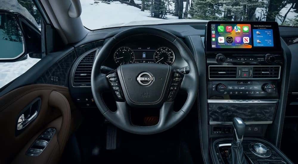 A close up shows the dash and infotainment screen in a 2023 Nissan Armada.