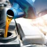 Technician performing oil change