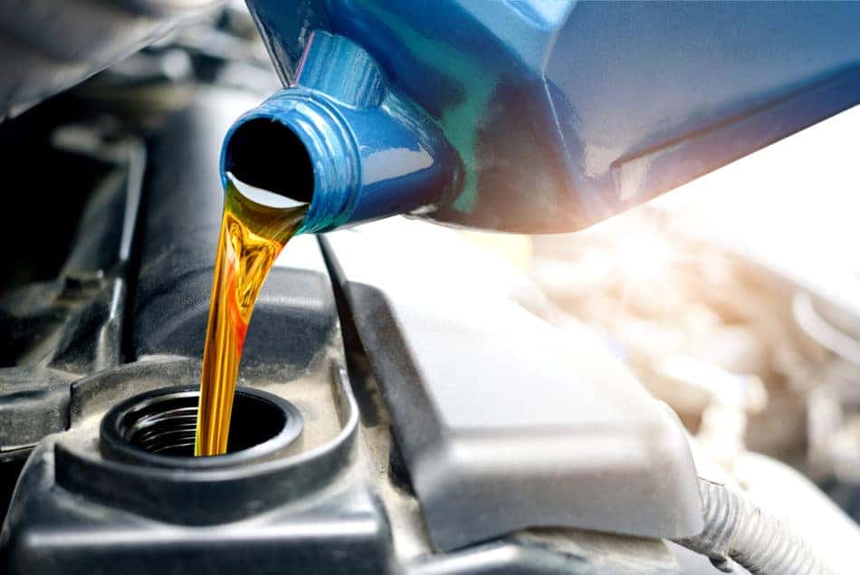 Technician performing oil change