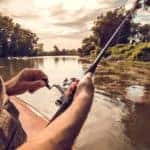 Closeup of someone fishing with a pole