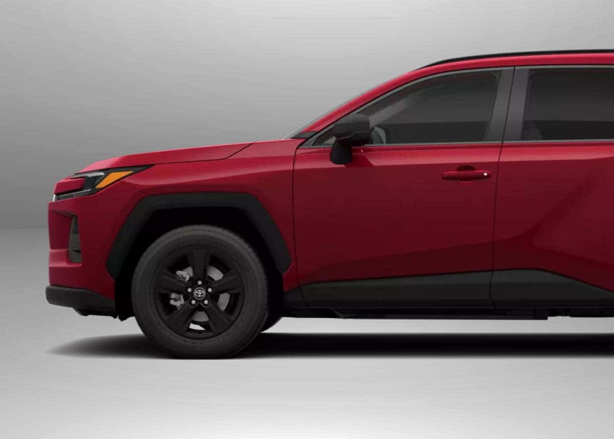 2026 Toyota RAV4 LE with sleek modern design and a black grille viewed from the front at an angle.