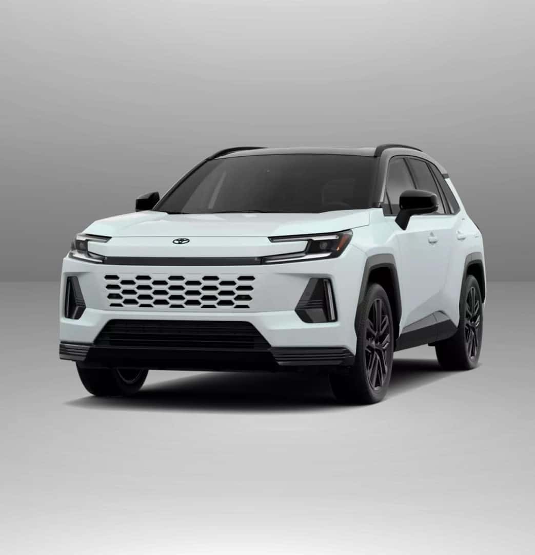 2026 Toyota RAV4 XSE with a modern design and hexagonal grille, set against a neutral gray background.