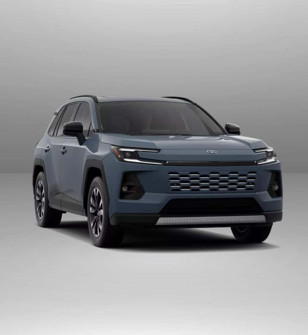 2026 Toyota RAV4 Limited stands in a studio setting, featuring a modern design with sleek headlights and a bold front grille.